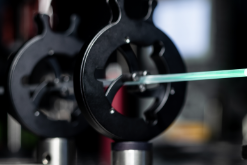 Decisive progress through optical laser cooling of quartz glass by 67 Kelvin in collaboration with the University of New Mexico.